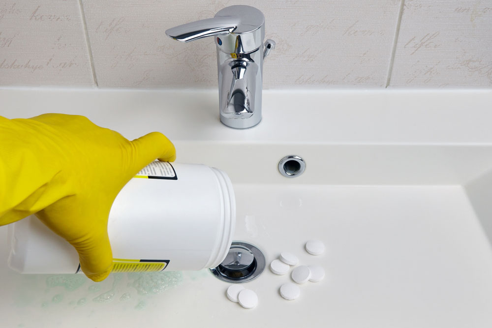 Chemical drain cleaner poured on sink