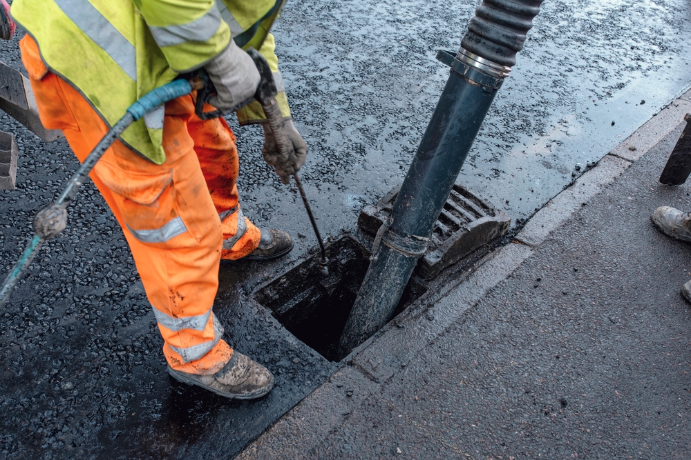 contractor cleaning a sewer line