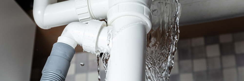 Water Leaking From The White Sink Pipe